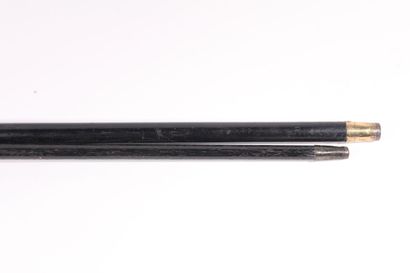 null A monoxyle cane in black wood, pommel opera, iron ferule. Broken and glued back...