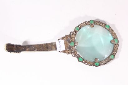 null Magnifying glass in silver plated metal and celadon jade
China, early 20th century
The...