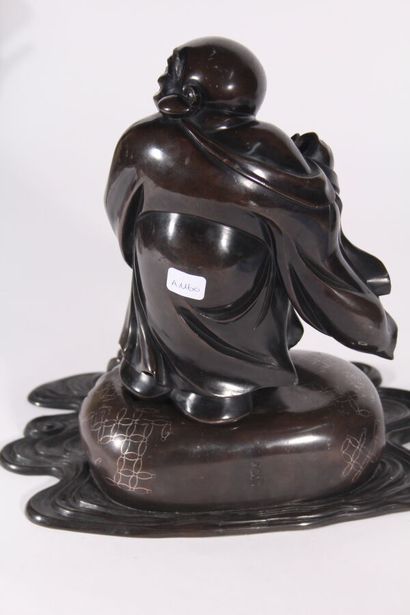 null Hotei statuette in bronze inlaid with silver
Japan, early 20th century
Depicted...