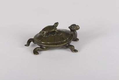 null Bronze turtle inlaid with silver 
China, early 20th century 
The head raised,...