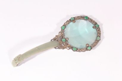 null Magnifying glass in silver plated metal and celadon jade
China, early 20th century
The...