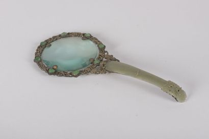 null Magnifying glass in silver plated metal and celadon jade
China, early 20th century
The...