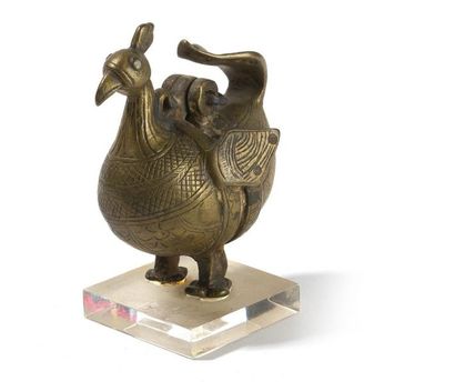 null BRÛLE PARFUM
représentant un paon. Bronze et fer.
Perse, XIXème siècle
Haut.:...