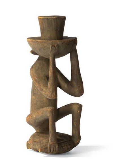 null STATUETTE SINGE
mangeant un épi de maïs. Bois sculpté.
Cassé, collé
Côte d'Ivoire.
Haut.:...