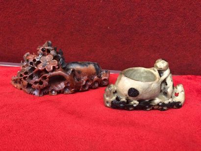 null Two steatite soapstone cups veined with beige, brown, red, one carved with a...