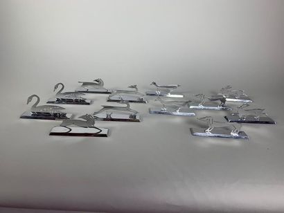 null Twelve silver plated metal knife holders in the shape of various animals.