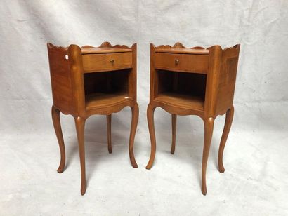 null Pair of cherry wood bedside tables opening to a drawer and a niche and resting...