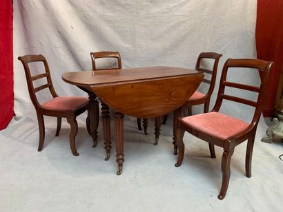 null Mahogany veneer flap dining table with four chairs. 19th century.