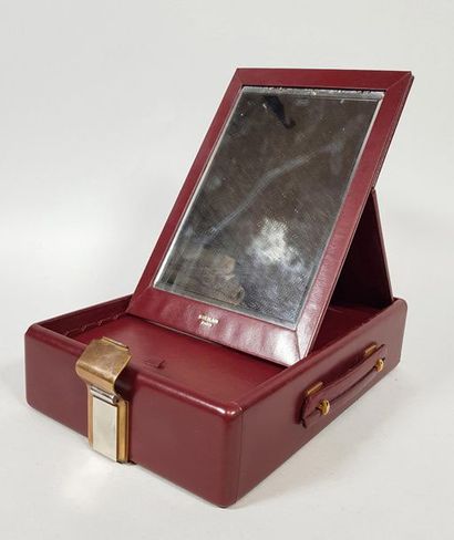 null GUERLAIN Paris
Wooden travel case covered with burgundy leather, revealing its...