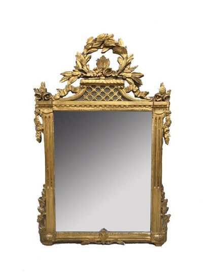 Wooden pediment mirror carved with a floral...