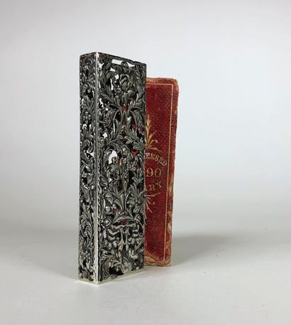 null [SILVER] Openwork silver case (7.9 x 2.5 cm) with putti motifs in a large floral...