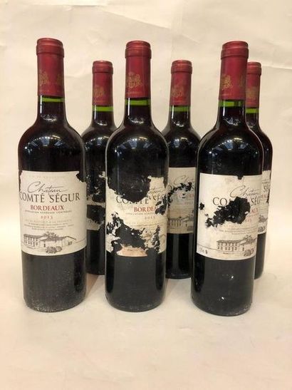 null Six bouteilles de Bordeaux, château Comté Ségur, cinq, 2013, une étiquette ...