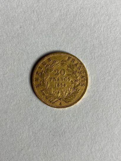 null Une pièce de vingt francs or au profil de Napoléon III, 1854.
