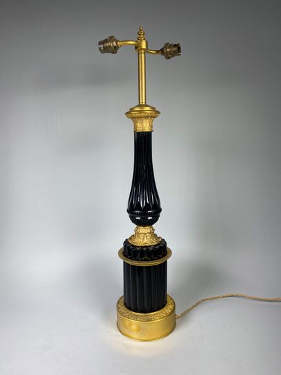 null Gilded bronze lamp stand carved with palmettes and cut glass with diamond points....