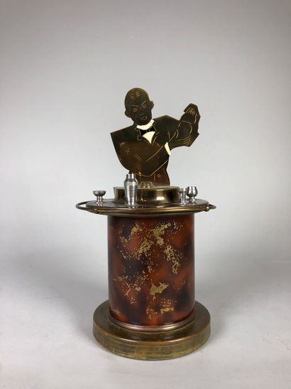 null Brass and lacquer smoker's set, the lid decorated with a bartender.

Around...