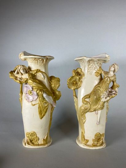 null ROYAL DUX BOHEMIA

Pair of porcelain vases decorated in relief with women and...