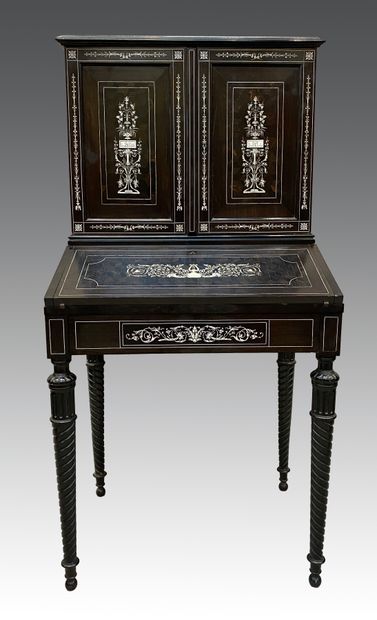 null Secretary in blackened wood inlaid with scrolls in 'ivory, opening to two leaves,...