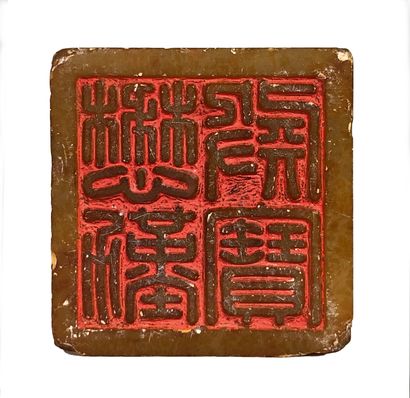  Honey-colored soapstone cachet, square in shape, the upper part carved in the round...