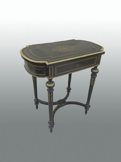 null Blackened wood dressing table opening to a flap resting on four tapered and...