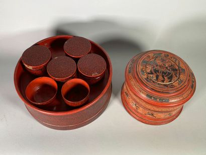 null Two cylindrical lacquer boxes, one with polychrome decoration of scrolls and...