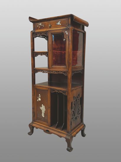 null Display cabinet in exotic openwork wood, comprising an upper drawer inlaid with...