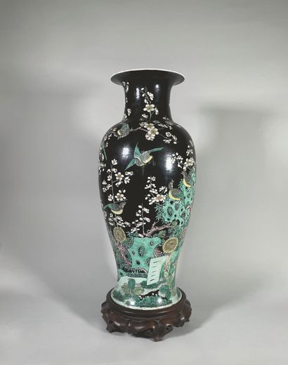 null Large porcelain baluster vase, decorated in green family enamels on a black...