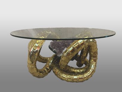 null Henri FERNANDEZ (1946)
Table basse "Cobra". 
Plateau circulaire en verre reposant...