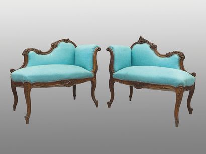 null Pair of walnut "conversations", molded and richly carved with shells and staples....