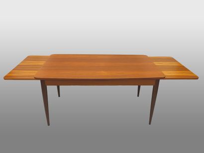 null Teak table, rectangular top (two extensions) resting on four tapered legs. 
Denmark,...