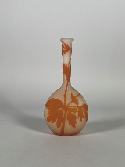 null GALLE 
Acid-etched glass soliflore vase with orange flowers on a white background....