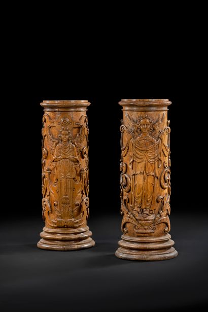 Pair of carved oak pedestals with angels...