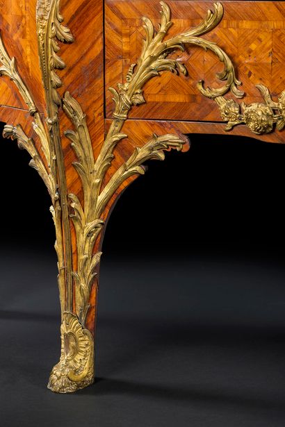 null A trapezoidal-plan commode in satin-finish and marquetry of lattice work, and...