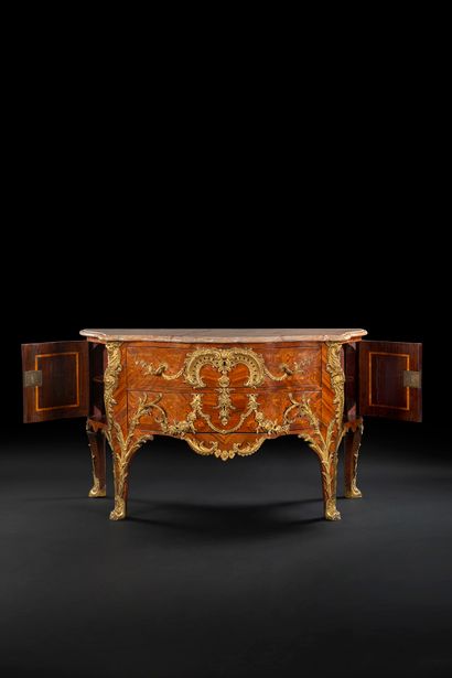 null A trapezoidal-plan commode in satin-finish and marquetry of lattice work, and...