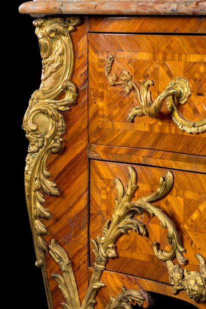 null A trapezoidal-plan commode in satin-finish and marquetry of lattice work, and...