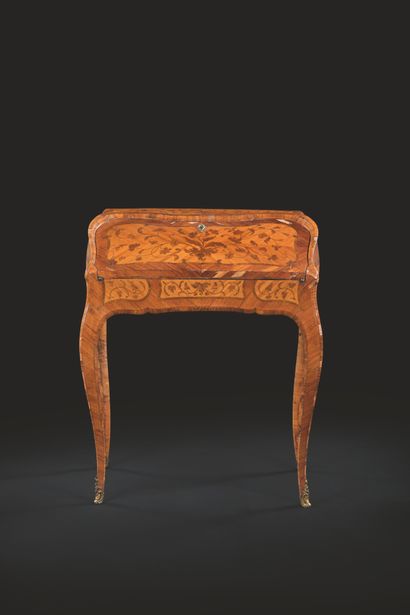 A sloping secretary in butt-wood flower marquetry,...