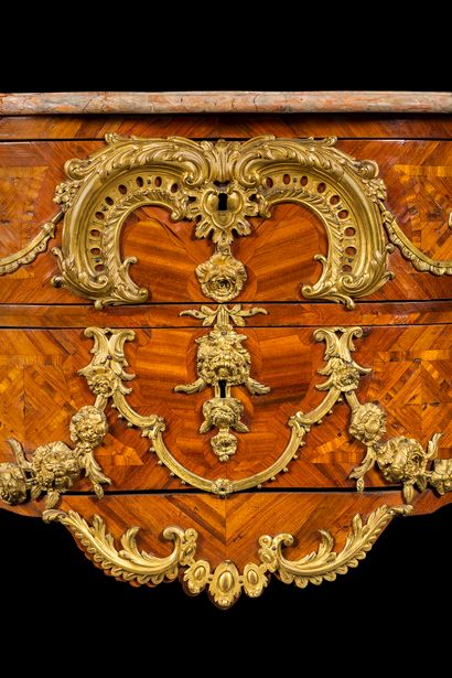 null A trapezoidal-plan commode in satin-finish and marquetry of lattice work, and...