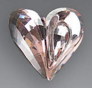 null SWAROWSKY en métal argenté et cristal rose à décor de coeur.