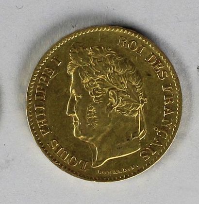 null Une pièce en or de 40 francs au profil de Louis-Philippe, 1833 (usures).