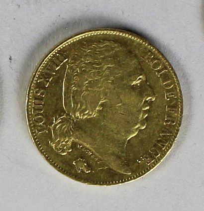 null Une pièce en or de 20 francs au profil de Louis XVIII, 1817 (usures).