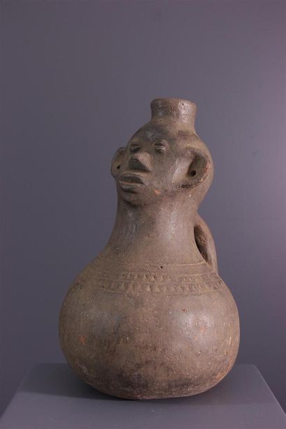 null Zande anthropomorphic jar, Azande, DRC
Vase featuring a human head with large...