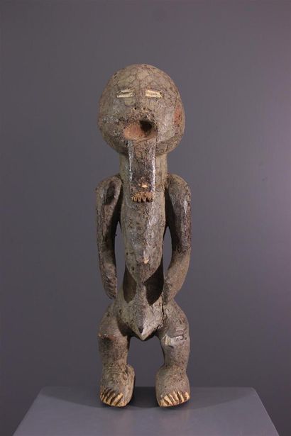 null Male figure Keaka, Kaakaa or Kaka, Cameroon.Standing on thick feet, this figure...