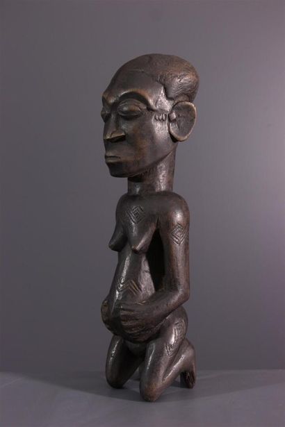 null Kuba female figure, DRC
Sculpted African figure associated with male initiation...