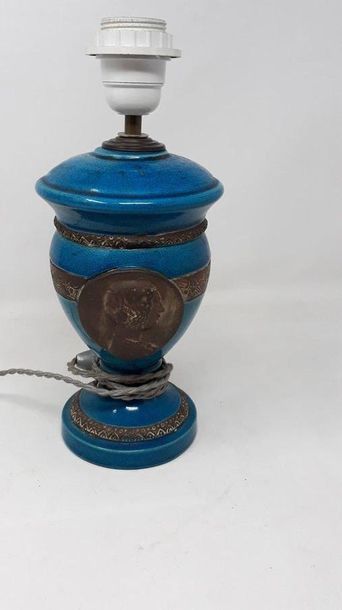 null Turquoise blue cracked earthenware urn with profile decoration in a medallion...