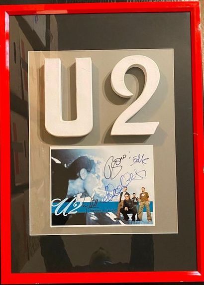U2 1 photo signée - U2 

Cadre en verre et montage