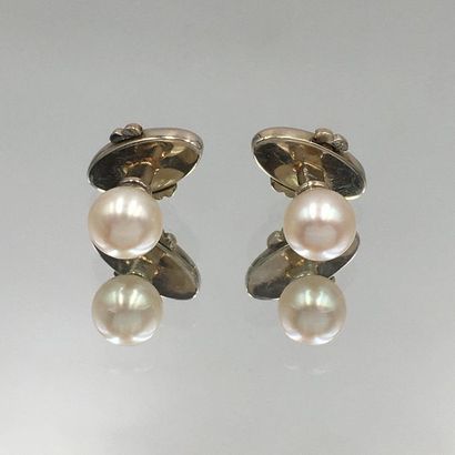 null Pair of NECK BUTTONS in white gold (750‰) set with a white pearl (not tested)....