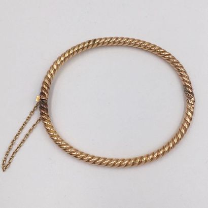 null Rigid opening BRACELET in yellow gold (585 thousandths) 14 carats, twisted....