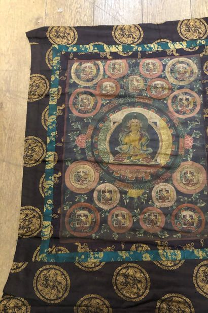 null Tibetan Tang Ka, painted decoration of a bodhitsava, border of

dragon lampas...