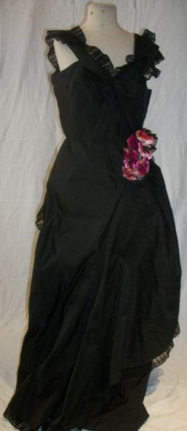 null Evening gown, circa 1950, sheath, cross straps, black satin with lace trim,...