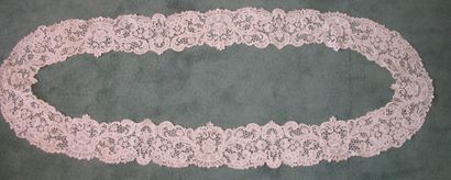 null Oval lace flounce with a big Venice stitch, rinceaux and flowers (rust stains)...