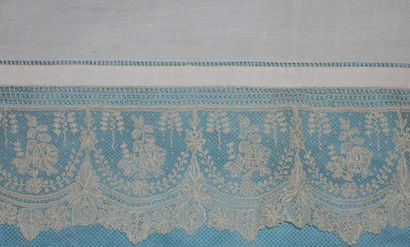 null Alençon lace flounce, decorated with sheaves of flowers, above flowery draperies....